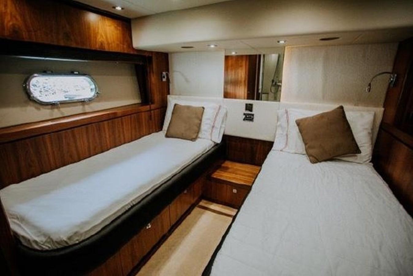 a couple of beds in a hotel room aboard ASTUR Yacht for Sale