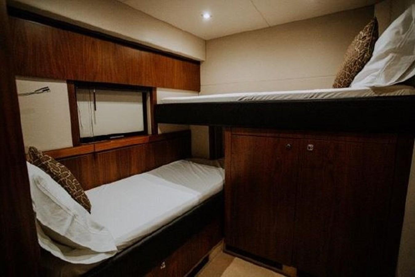 a bed with a mirror above it aboard ASTUR Yacht for Sale