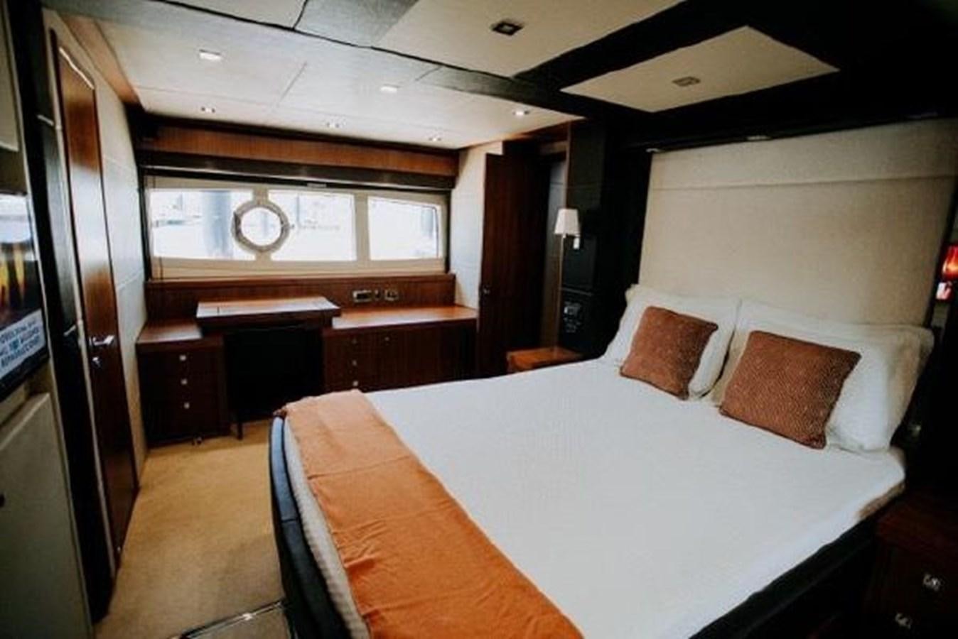 a room with a bed and a desk aboard ASTUR Yacht for Sale