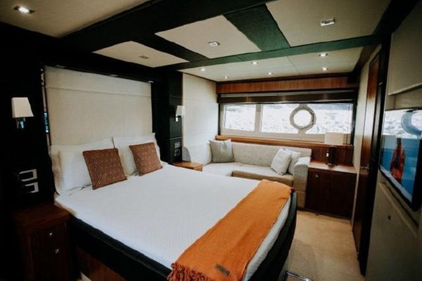 a room with a bed and a tv aboard ASTUR Yacht for Sale