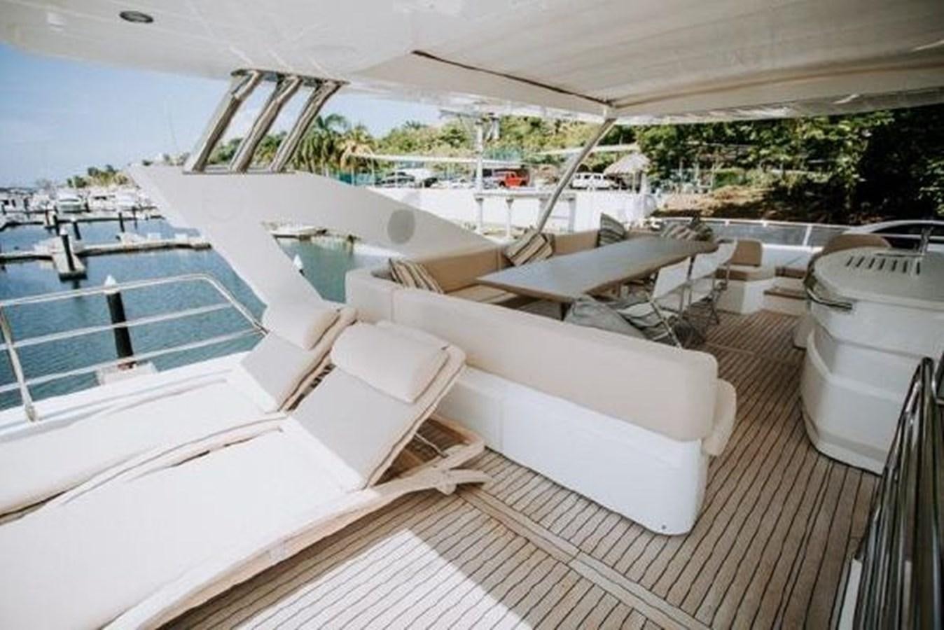 a deck with a pool and a deck with boats on it aboard ASTUR Yacht for Sale