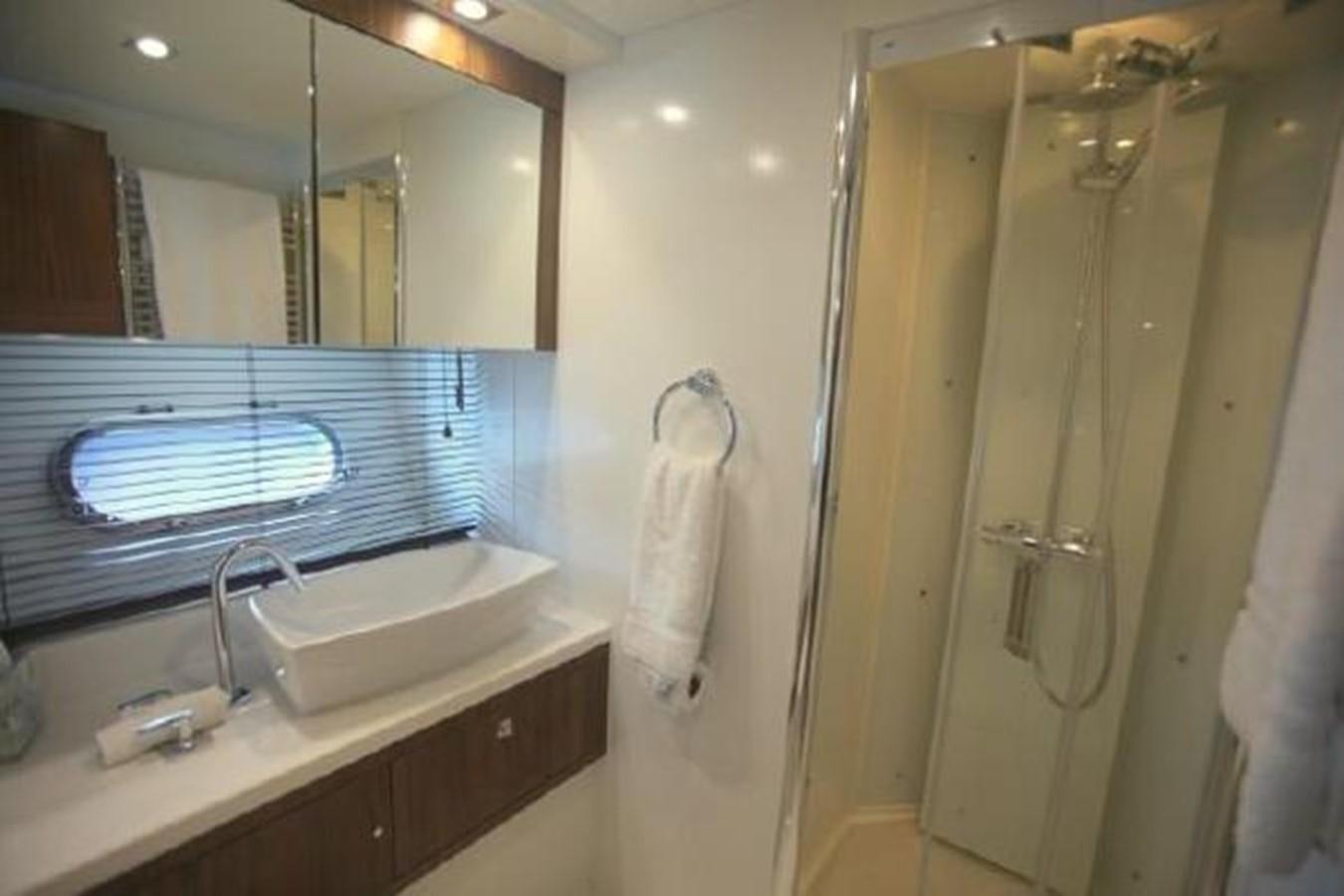 a bathroom with a large mirror aboard SAM JADE Yacht for Sale