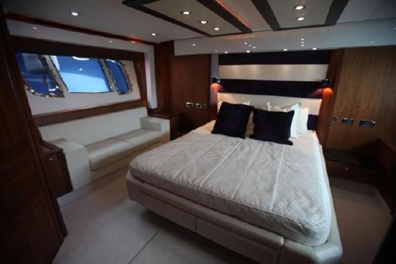 a room with a bed and a window aboard SAM JADE Yacht for Sale