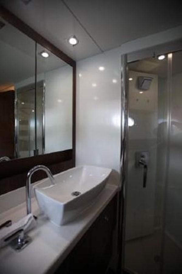 a bathroom with a sink and a shower aboard SAM JADE Yacht for Sale