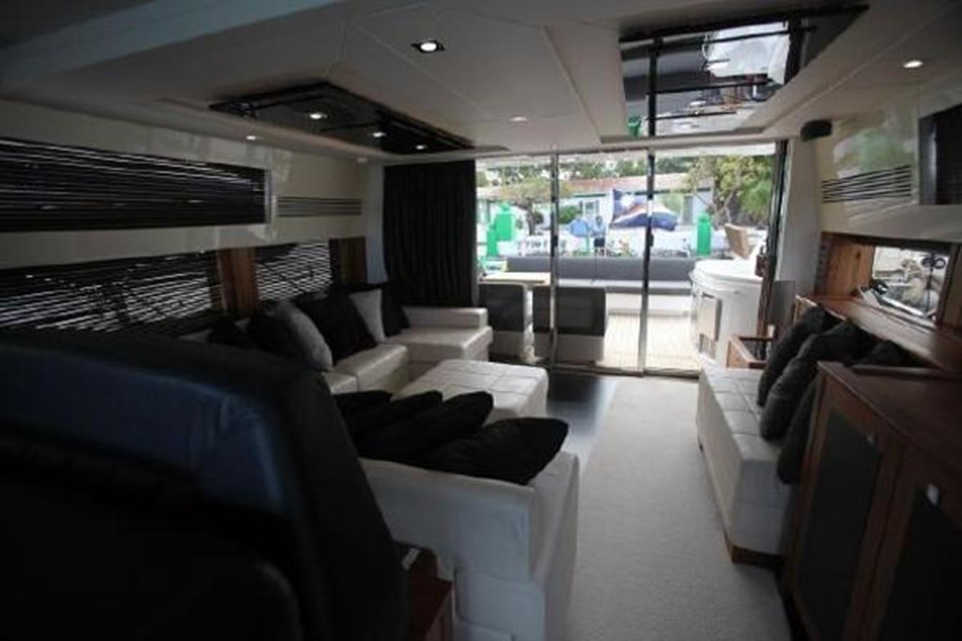 a room with couches and a table aboard SAM JADE Yacht for Sale