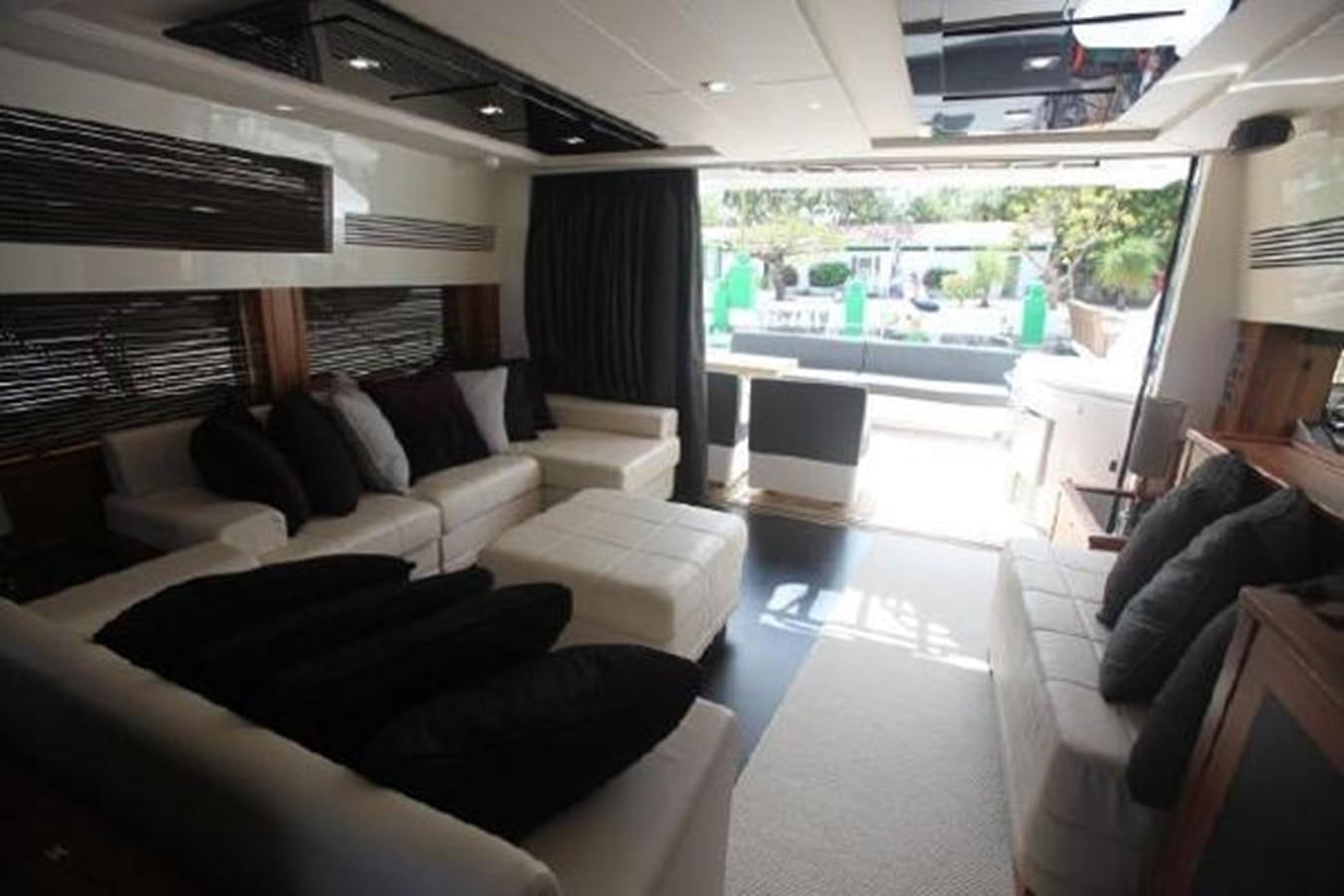a living room with a large window aboard SAM JADE Yacht for Sale