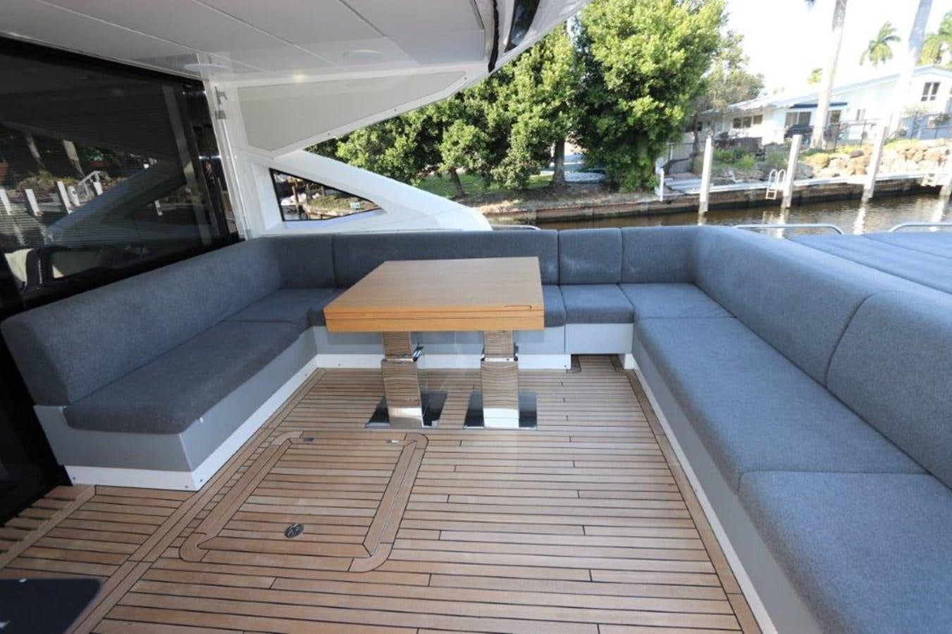 a wooden deck with a bench aboard HIDE OUT Yacht for Sale