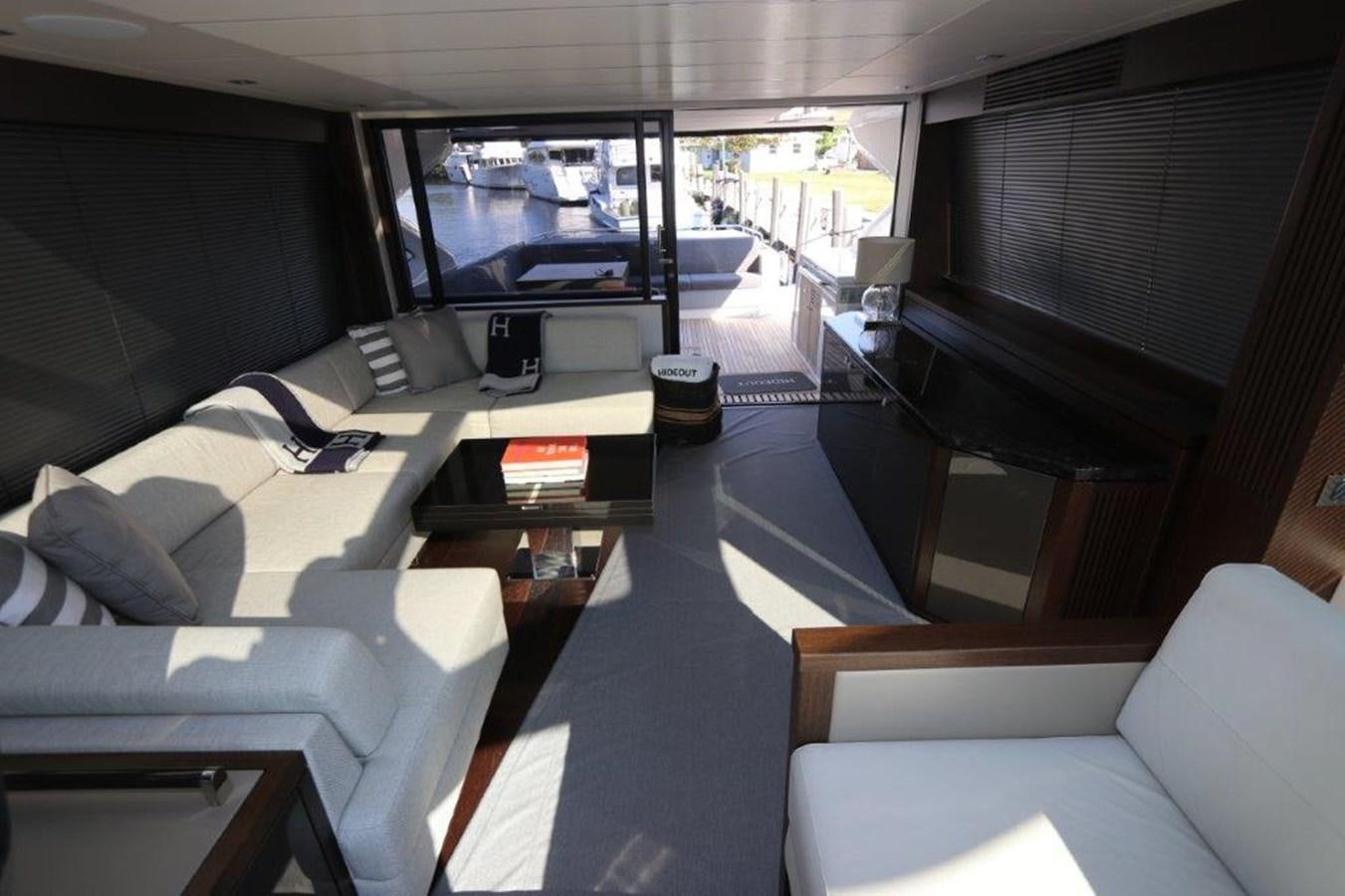 a room with a couch and a television aboard HIDE OUT Yacht for Sale