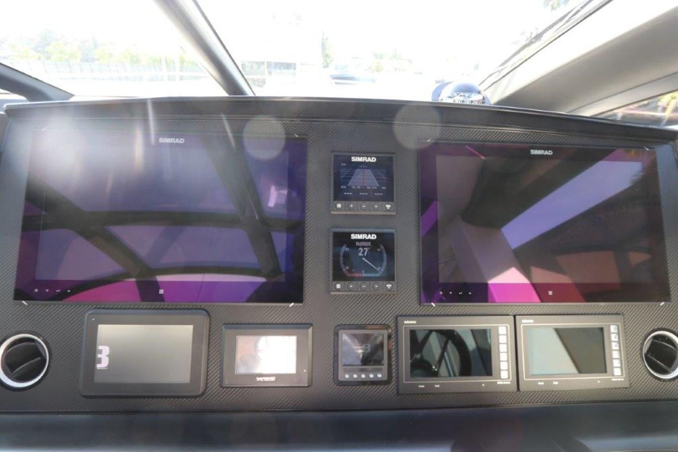 a car with many screens aboard HIDE OUT Yacht for Sale
