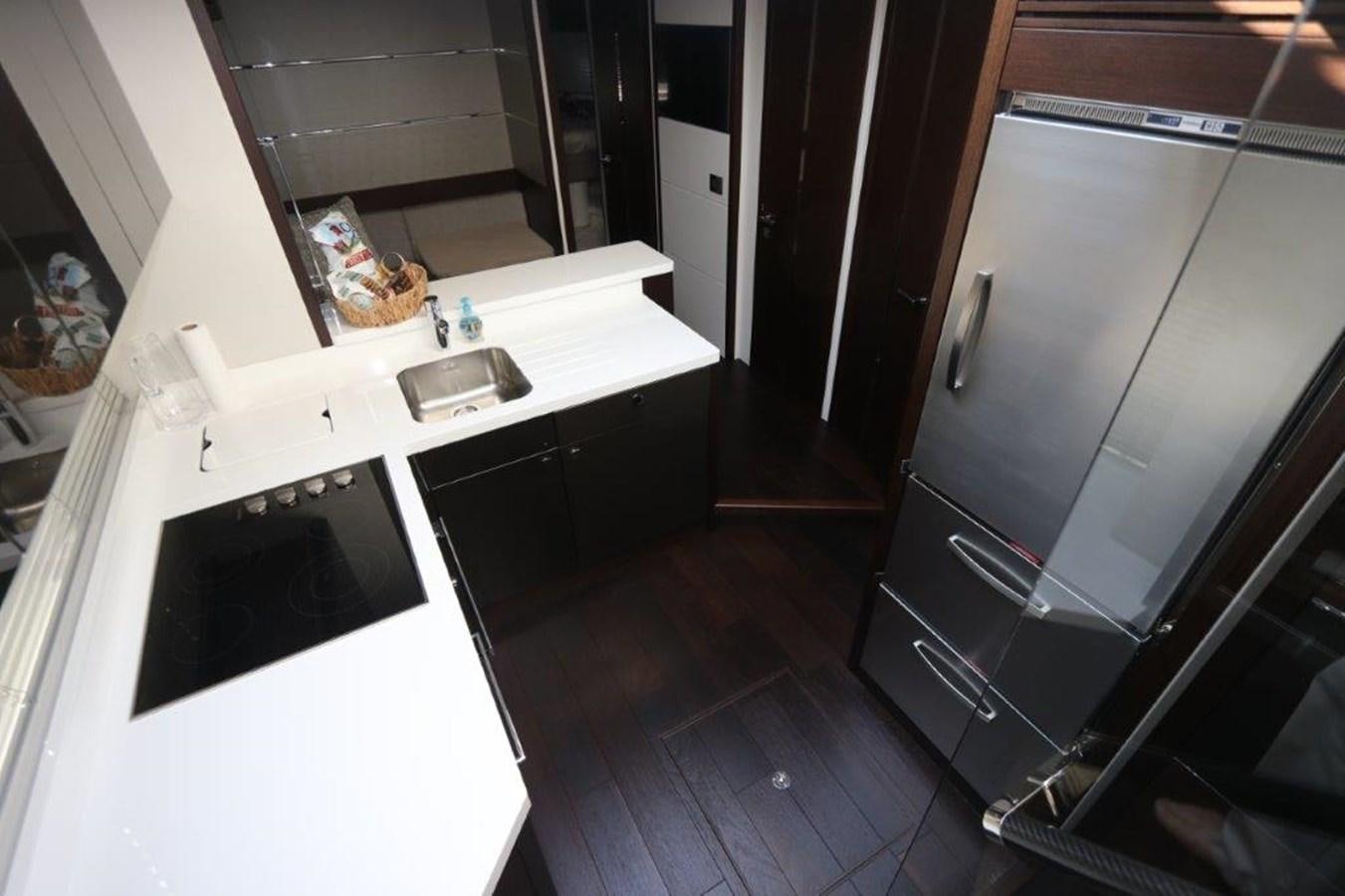 a kitchen with a sink and cabinets aboard HIDE OUT Yacht for Sale