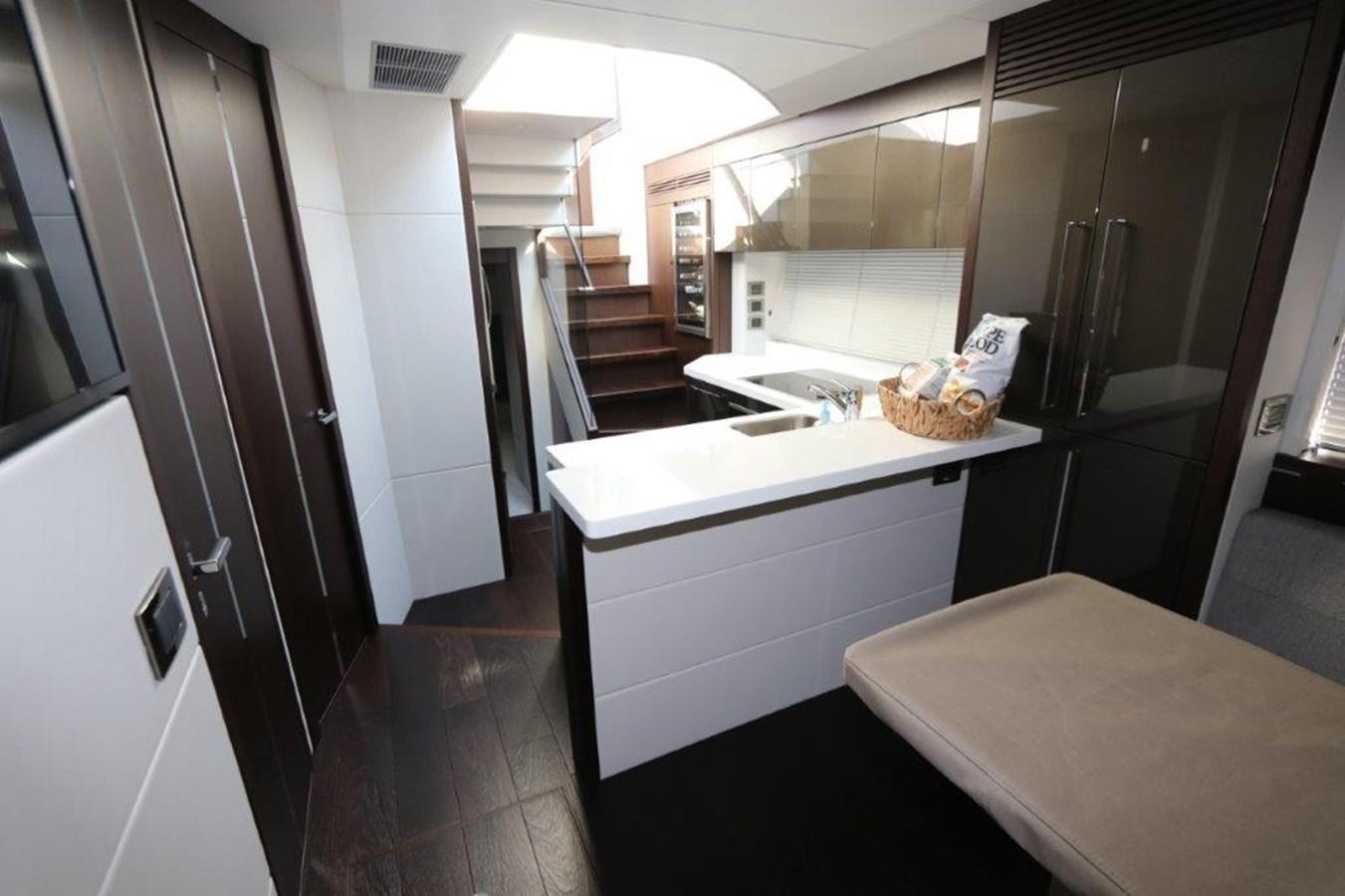 a kitchen with a sink and a table aboard HIDE OUT Yacht for Sale