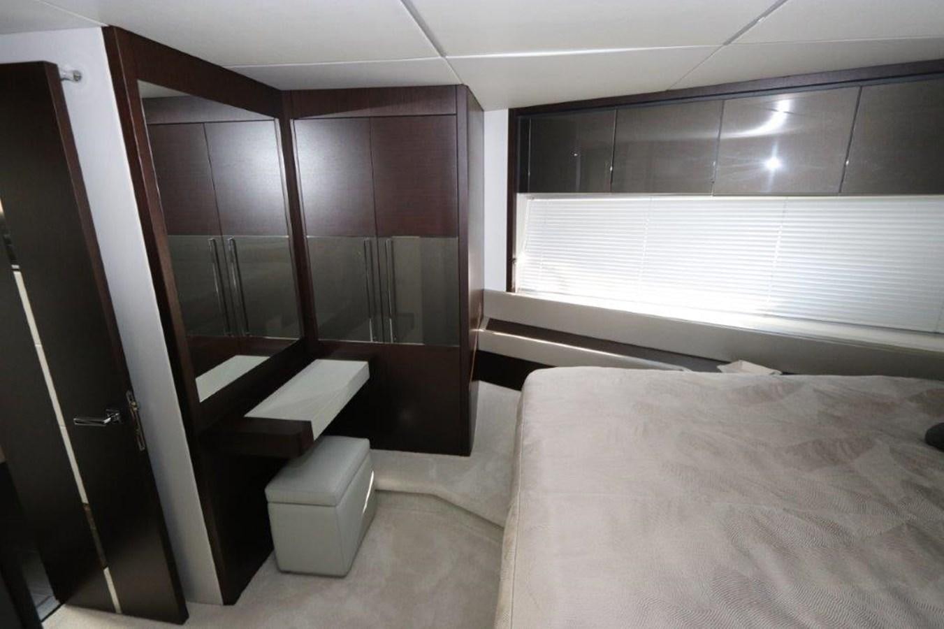 a room with a bed and a desk aboard HIDE OUT Yacht for Sale