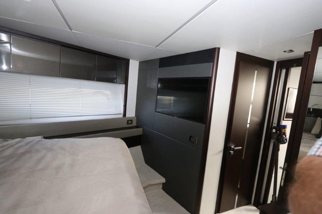 a room with a bed and a door aboard HIDE OUT Yacht for Sale