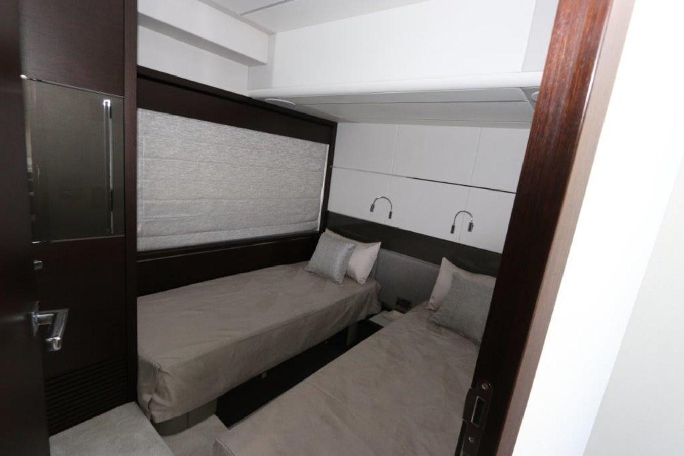a room with two beds aboard HIDE OUT Yacht for Sale