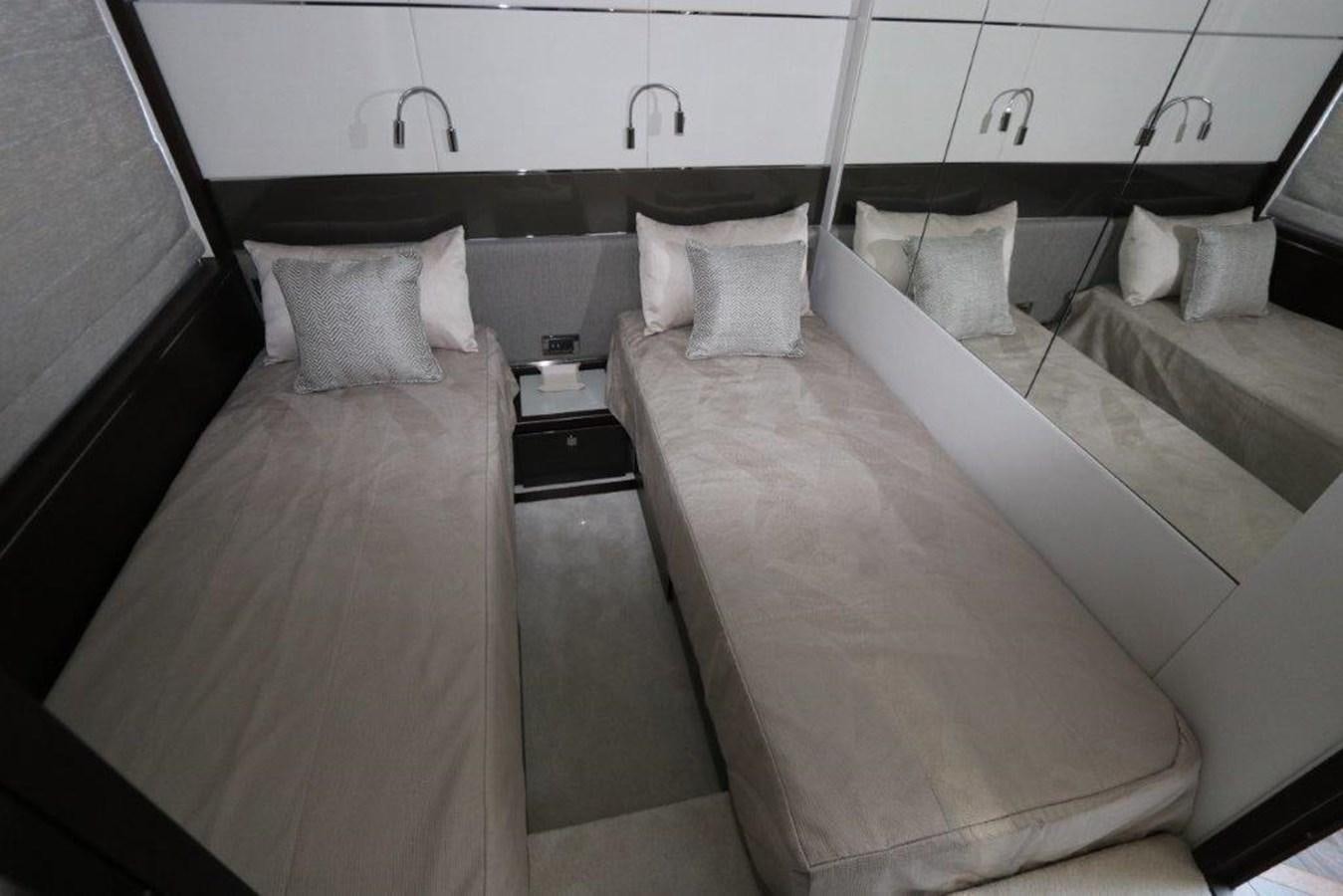 a room with two beds aboard HIDE OUT Yacht for Sale