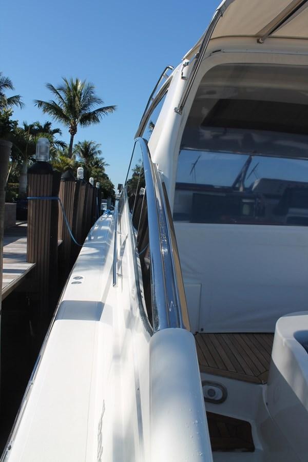 a white car with a door open aboard MAGNIFICA Yacht for Sale