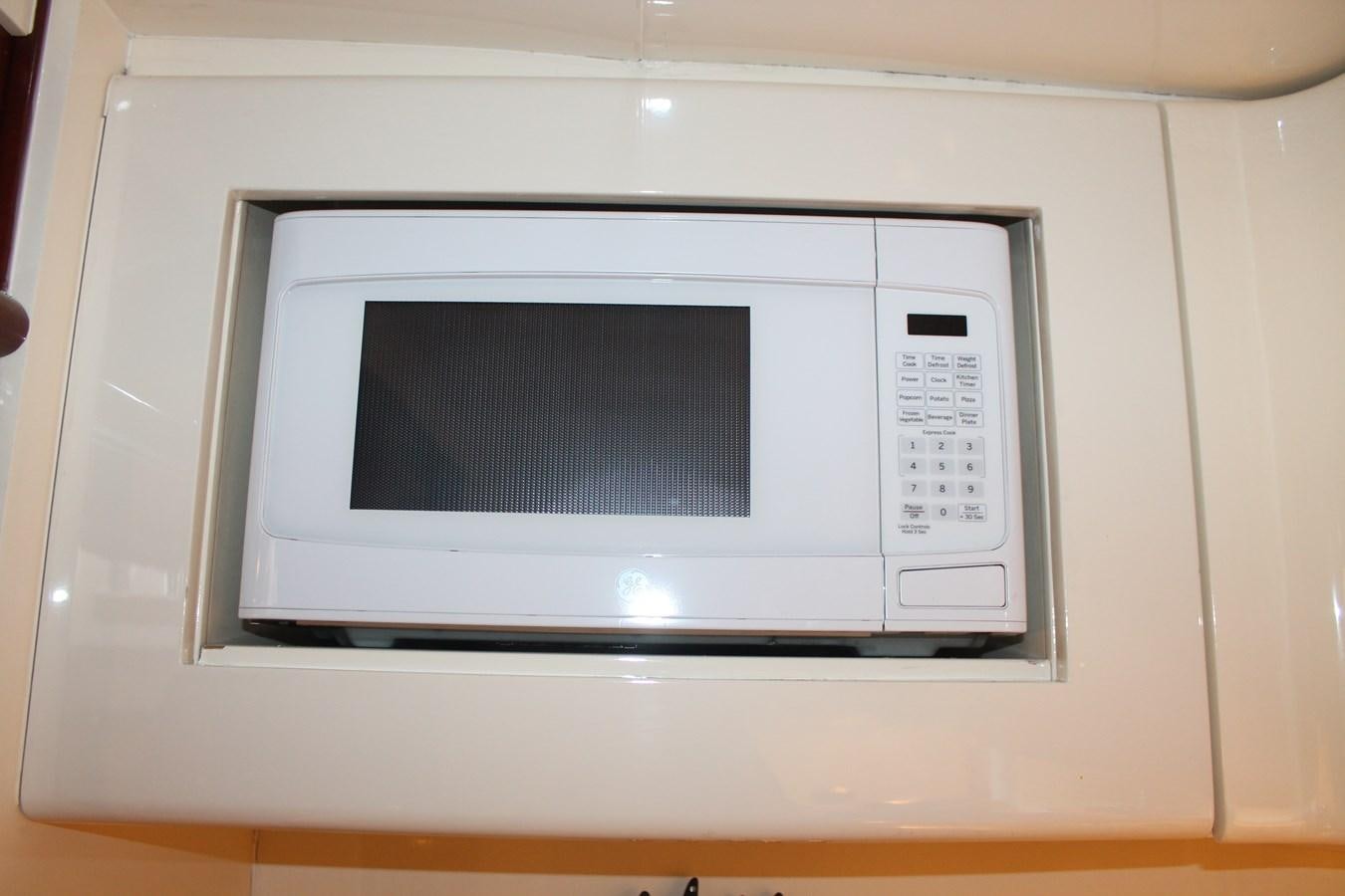 a microwave oven with a screen aboard MAGNIFICA Yacht for Sale