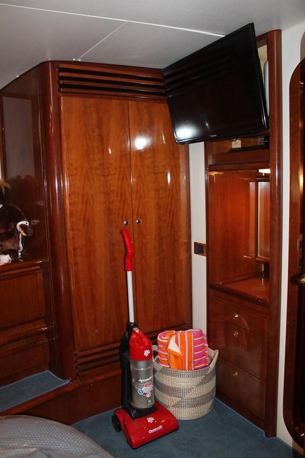 a room with a wood door and a couple of objects in it aboard MAGNIFICA Yacht for Sale