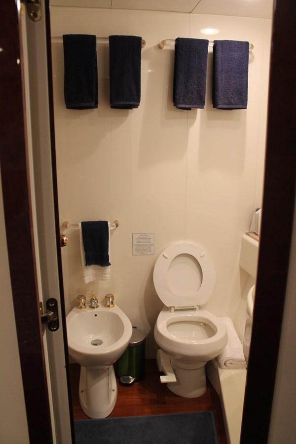 a bathroom with towels on the wall aboard MAGNIFICA Yacht for Sale