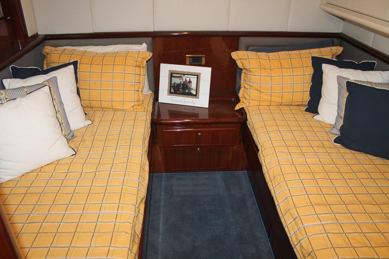 a couple of beds in a hotel room aboard MAGNIFICA Yacht for Sale