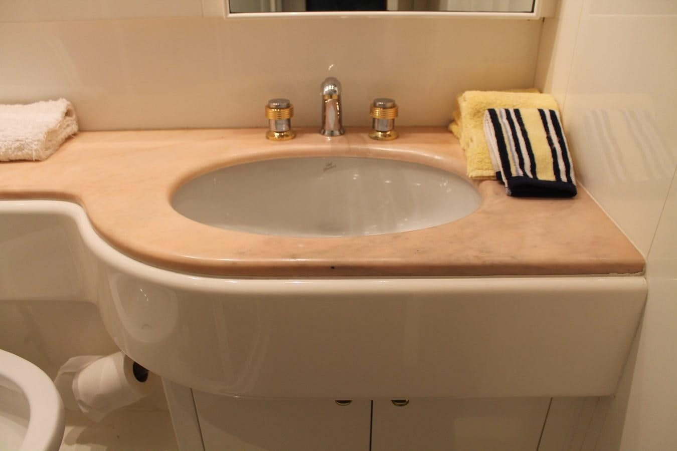 a sink with a towel and a towel on the side aboard MAGNIFICA Yacht for Sale