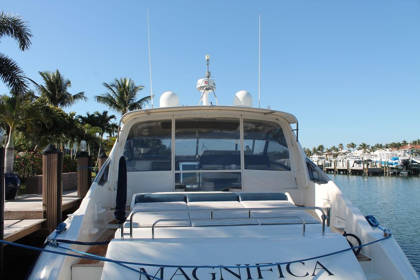 a white boat on a body of water aboard MAGNIFICA Yacht for Sale