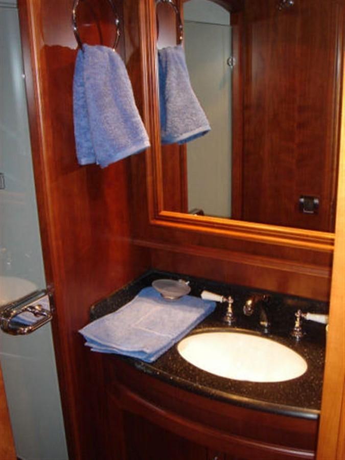a bathroom with a sink and towels aboard 75' 2008 YAPLUKA LUXURY CATAMARAN Yacht for Sale