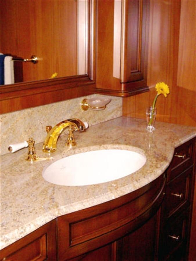 a bathroom sink with a yellow flower aboard 75' 2008 YAPLUKA LUXURY CATAMARAN Yacht for Sale