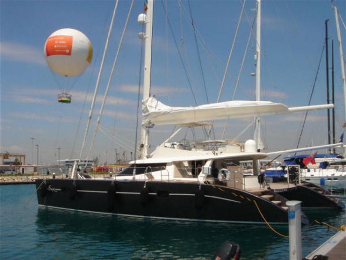 a boat docked at a pier aboard 75' 2008 YAPLUKA LUXURY CATAMARAN Yacht for Sale