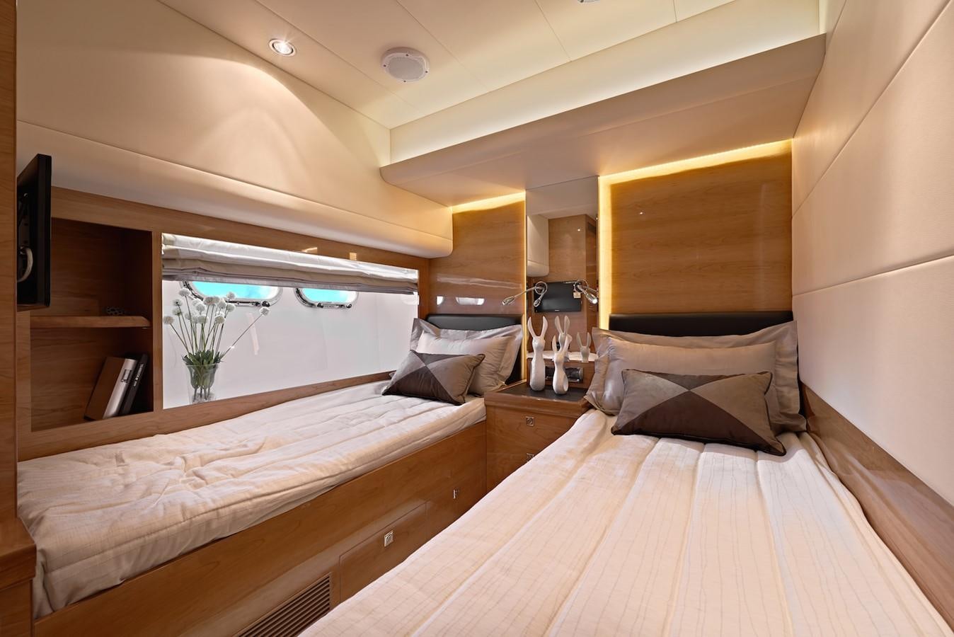 a room with two beds aboard JUSTIFIED Yacht for Sale