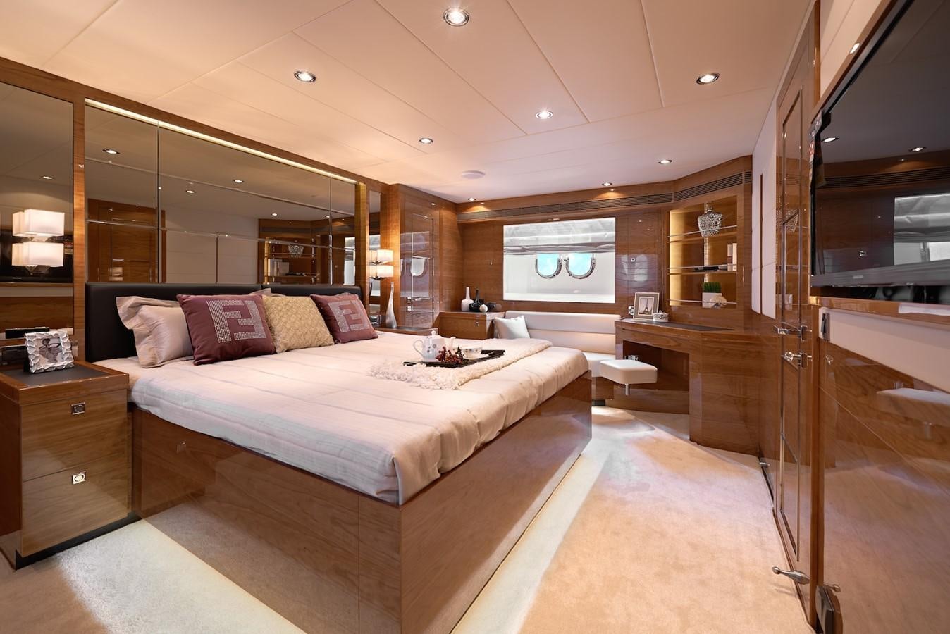 a large bedroom with a large bed aboard JUSTIFIED Yacht for Sale