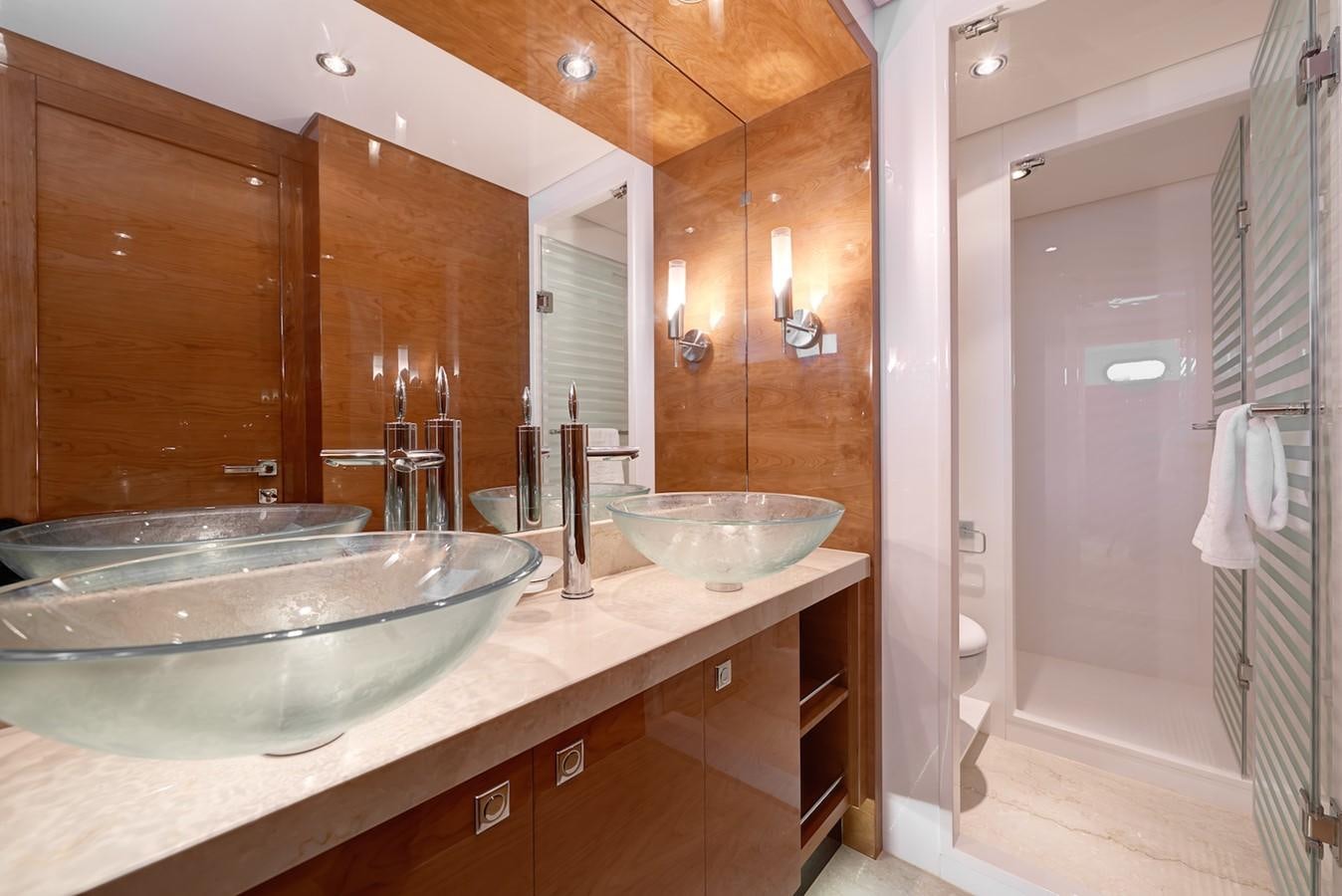 a bathroom with a sink and a mirror aboard JUSTIFIED Yacht for Sale