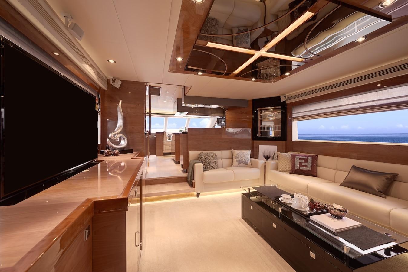 a room with a couch and a table aboard JUSTIFIED Yacht for Sale
