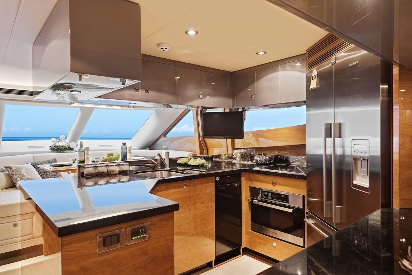 a kitchen with a large glass window aboard JUSTIFIED Yacht for Sale
