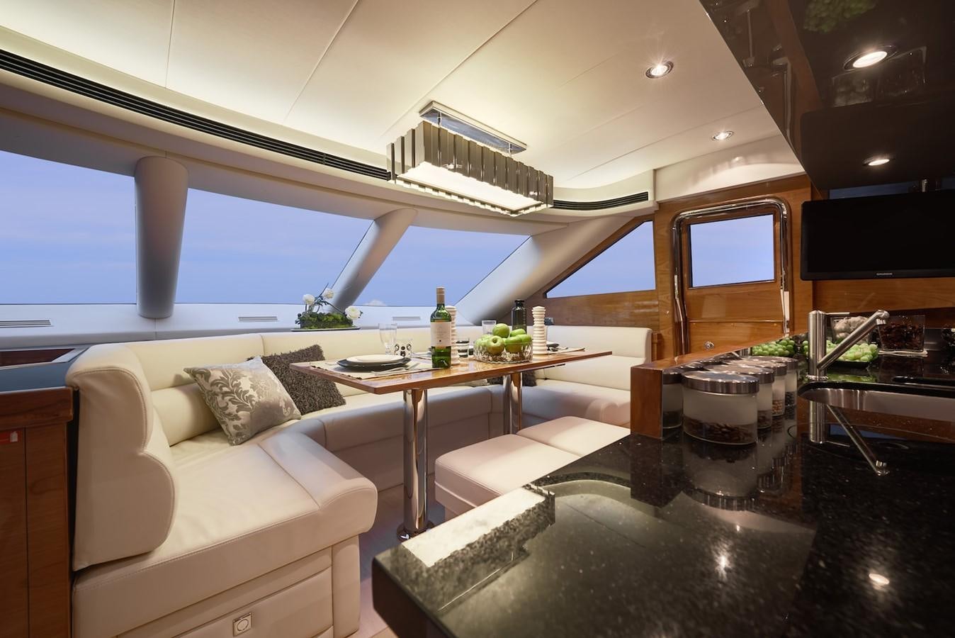 a living room with a large window aboard JUSTIFIED Yacht for Sale