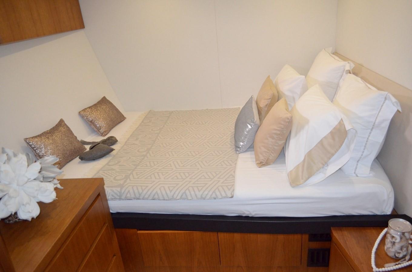 a bed with pillows and pillows aboard CASPA Yacht for Sale