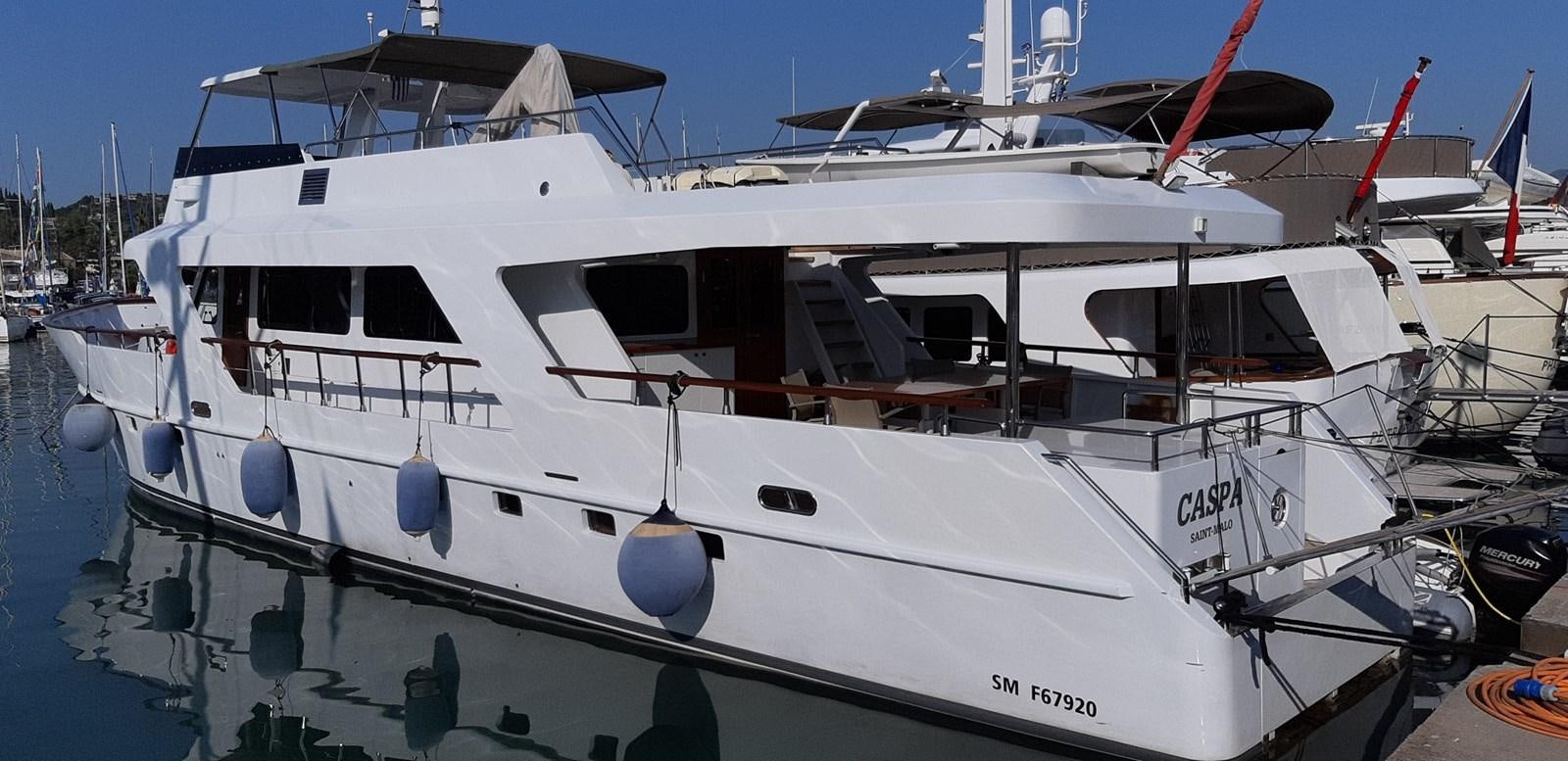 a boat docked at a pier aboard CASPA Yacht for Sale