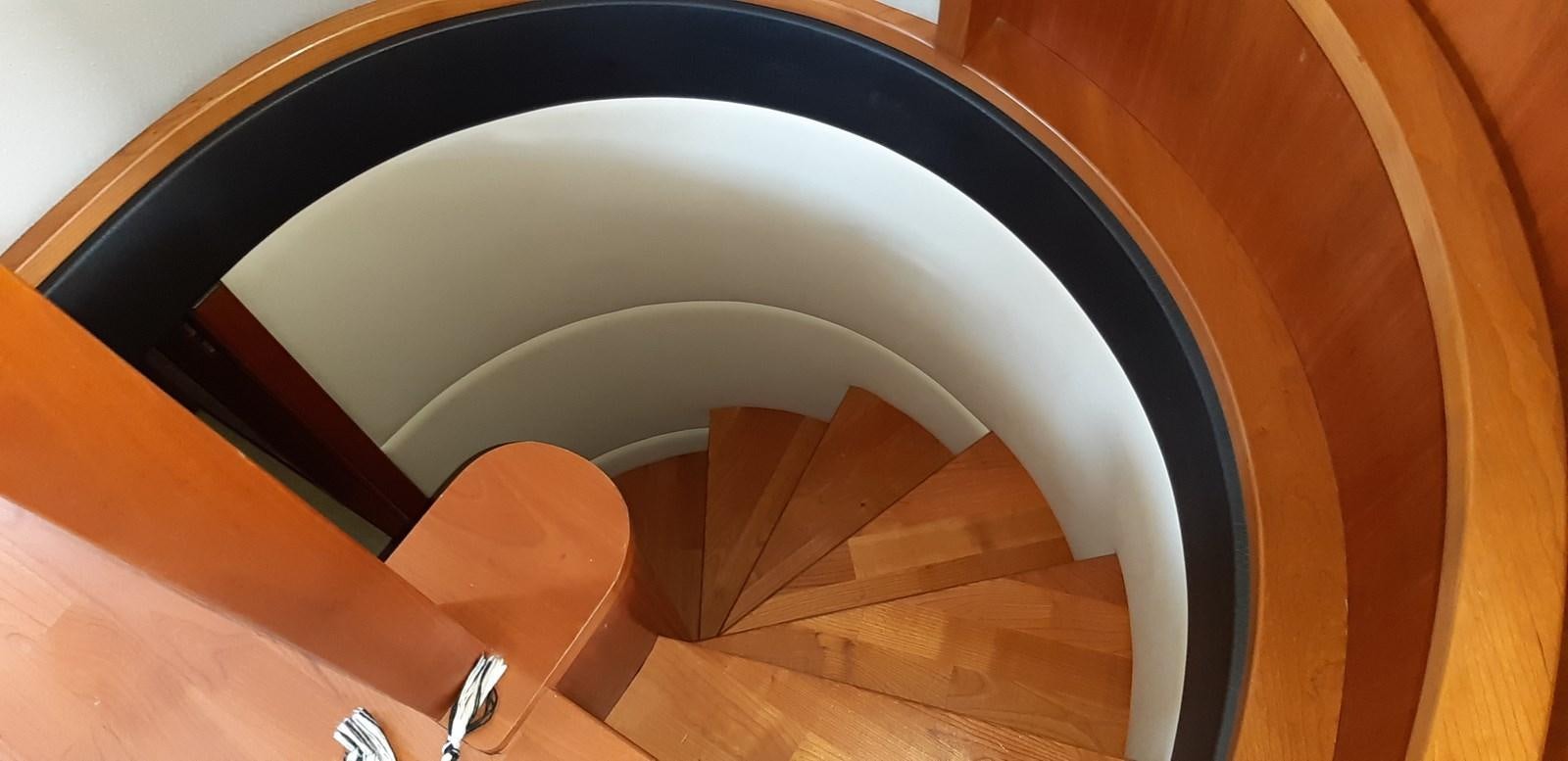 a round wooden table aboard CASPA Yacht for Sale