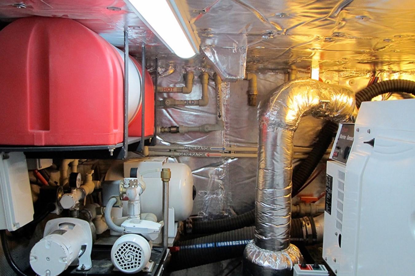 a large room with pipes and valves aboard CASPA Yacht for Sale