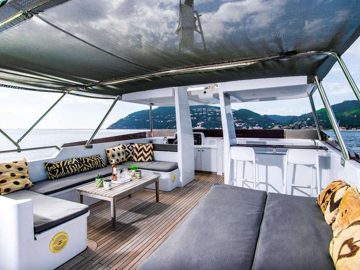 a room with a couch and a table aboard CASPA Yacht for Sale