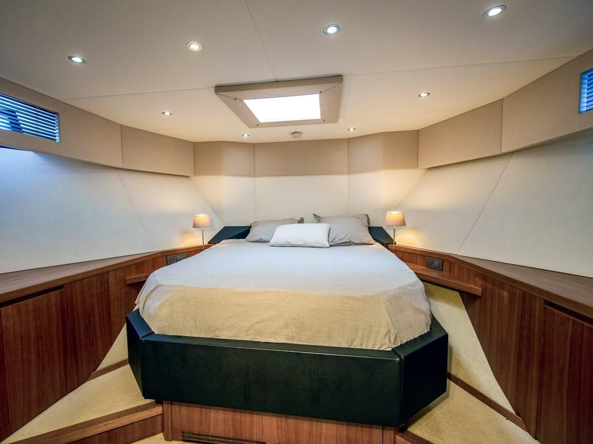 a bed in a room aboard CASPA Yacht for Sale