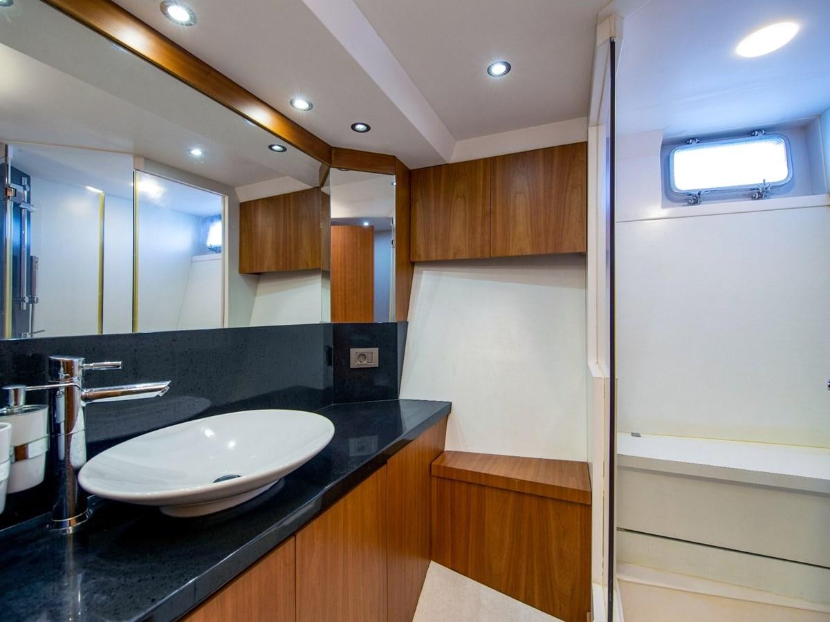 a bathroom with a sink and cabinets aboard CASPA Yacht for Sale