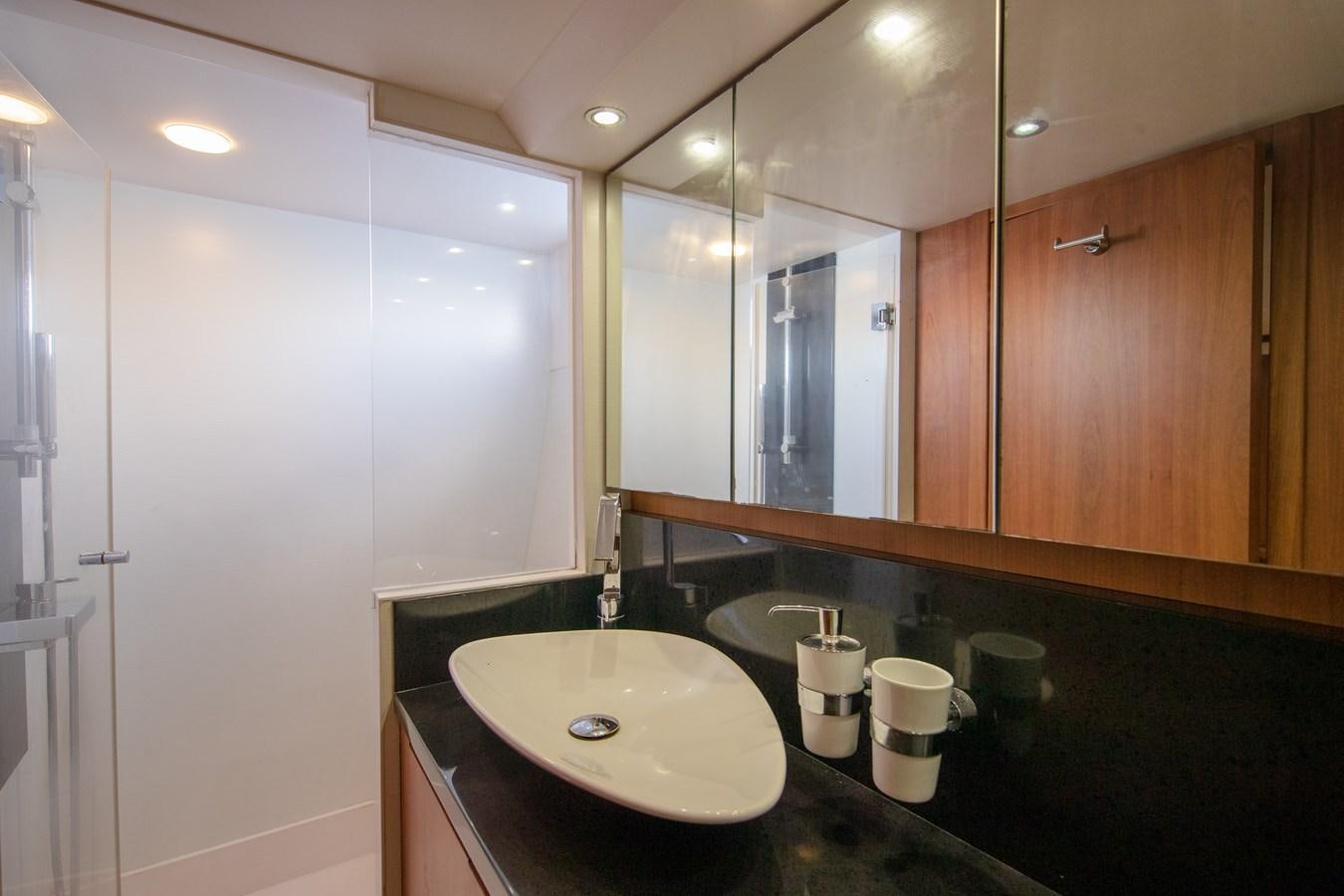 a bathroom with a sink and a mirror aboard CASPA Yacht for Sale