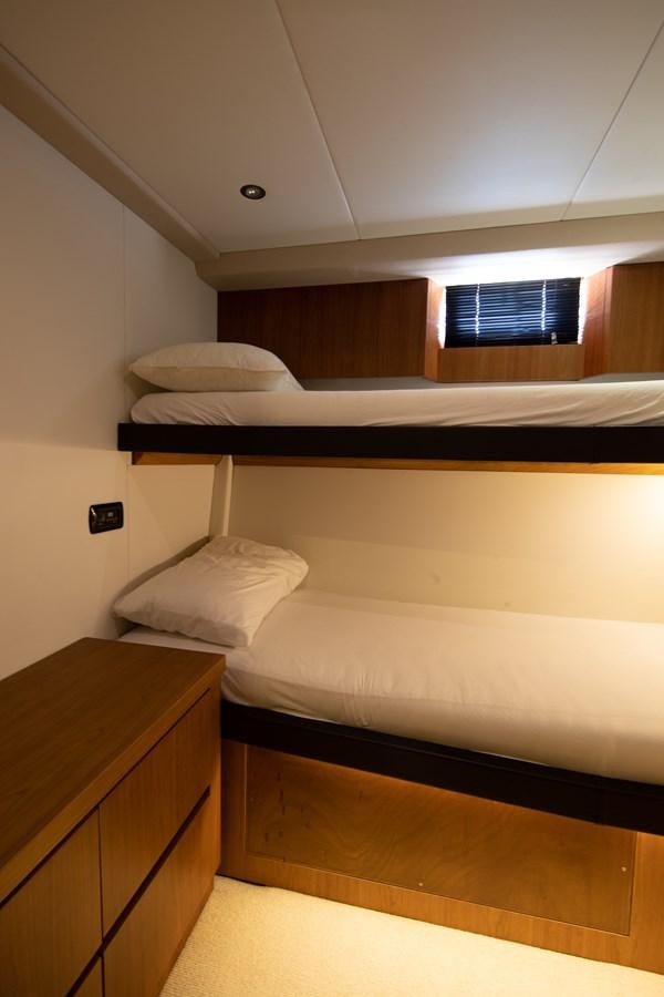 a room with two beds aboard CASPA Yacht for Sale