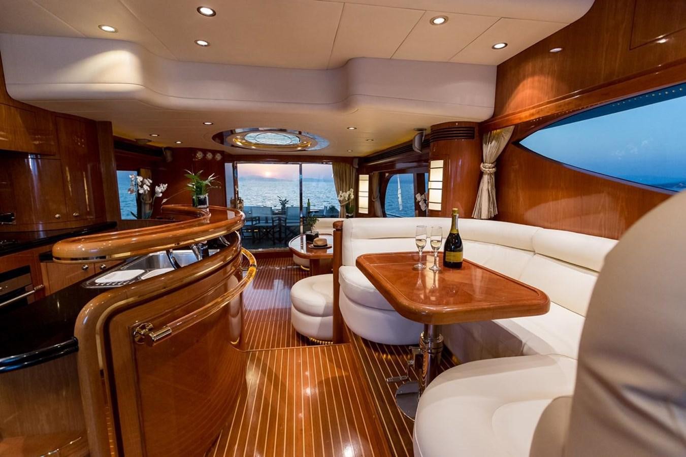 a room with a table chairs and a window aboard MARLIN Yacht for Sale