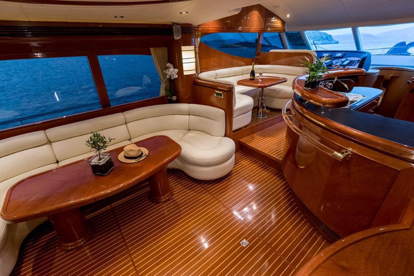 a room with a table and chairs aboard MARLIN Yacht for Sale