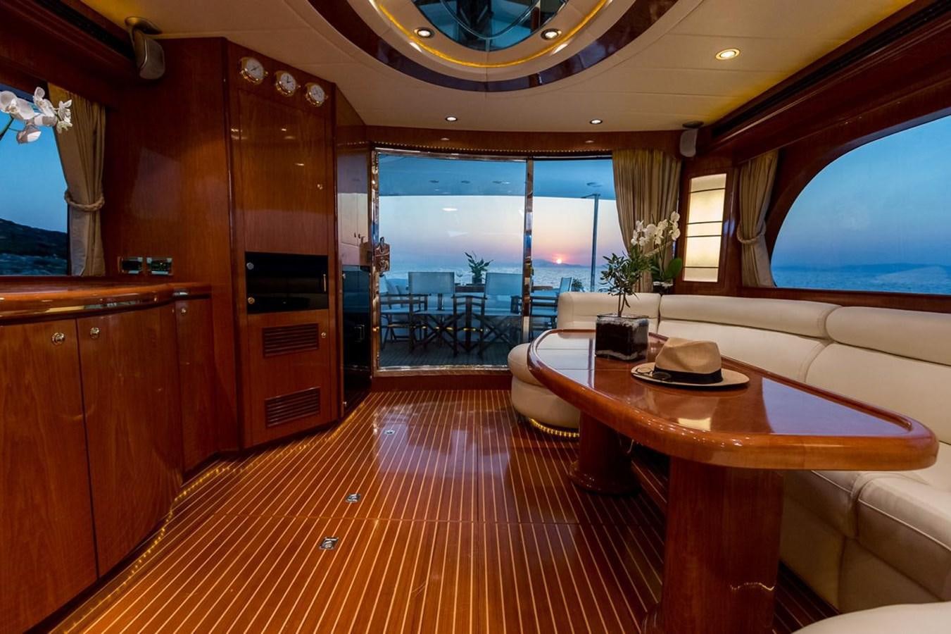 a room with a table and chairs aboard MARLIN Yacht for Sale