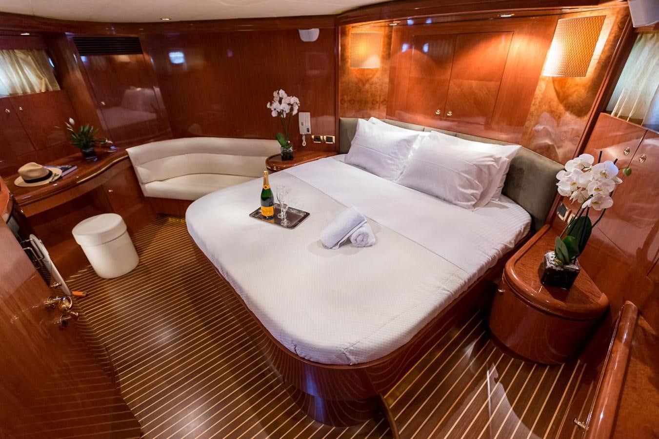 a room with a bed and a table aboard MARLIN Yacht for Sale