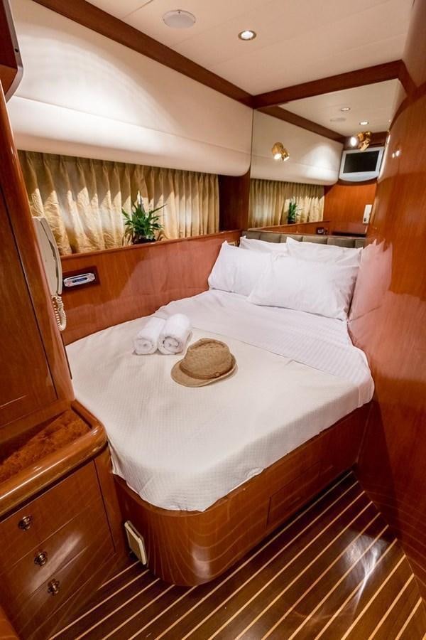 a bed with a round white bed aboard MARLIN Yacht for Sale