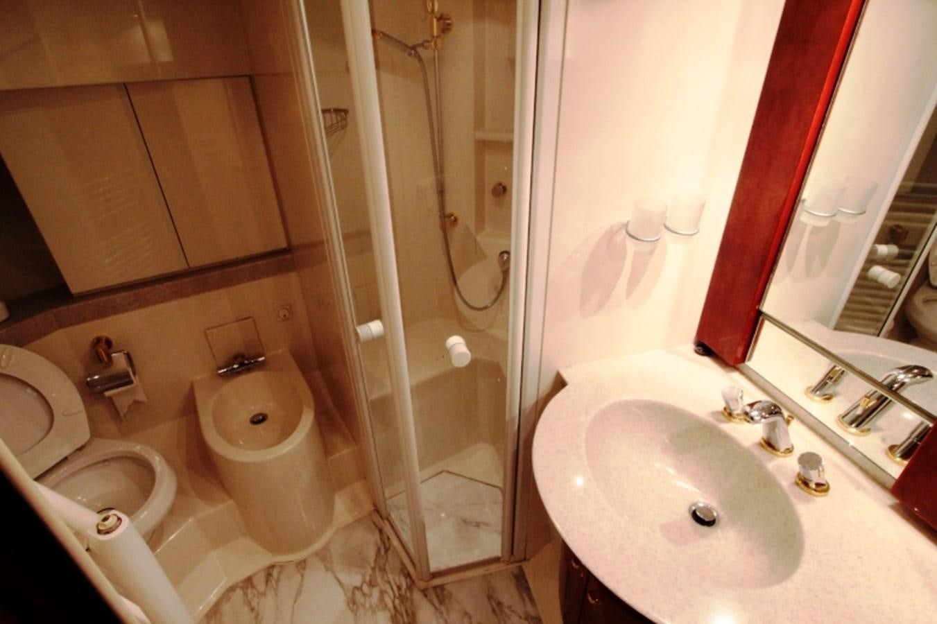 a bathroom with a shower and toilet aboard THE RIVER Yacht for Sale